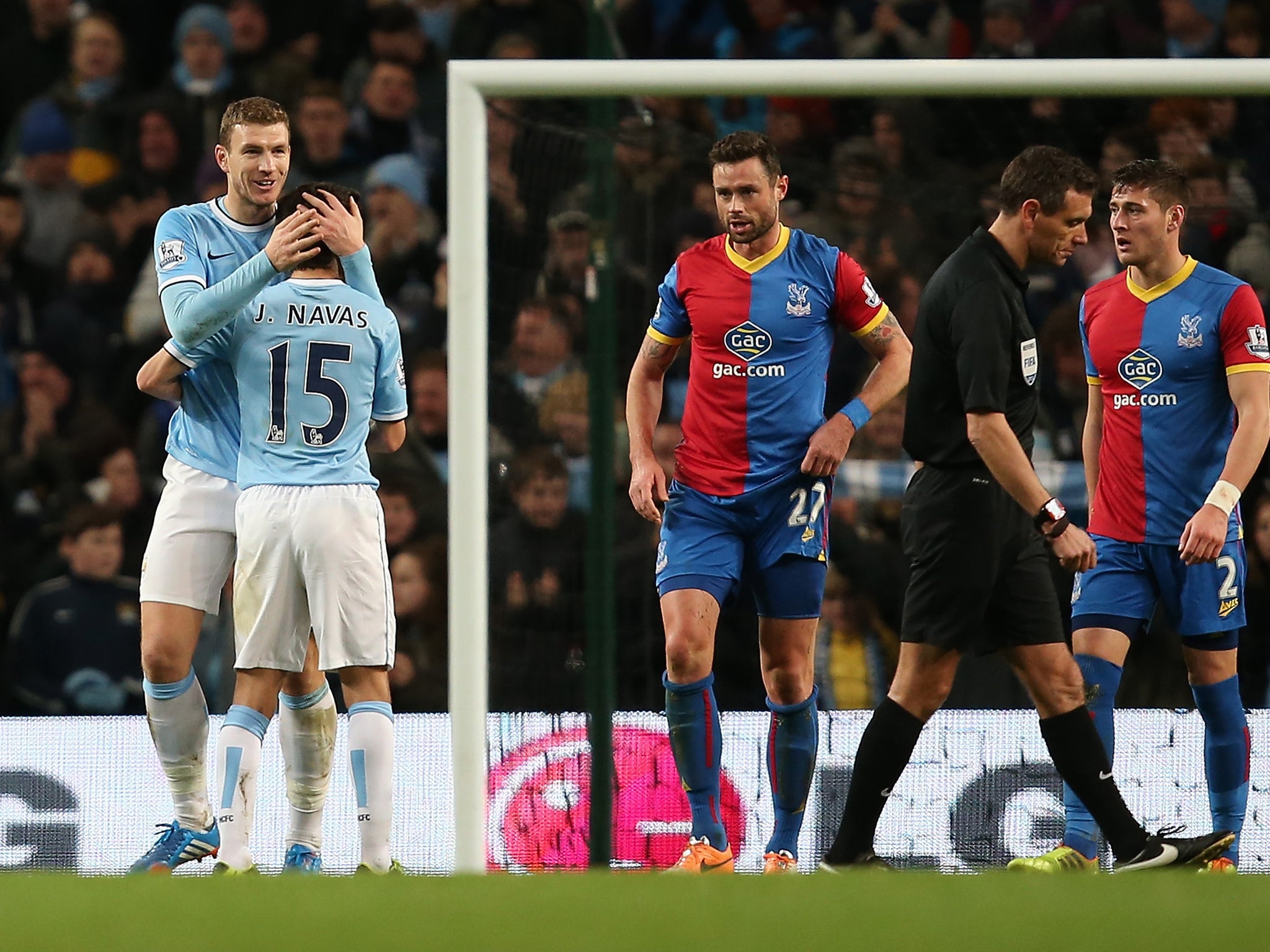 Edin Dzeko and Jesus Navas celebrate after the former scored the winning goal for Manchester City against Crystal Palace