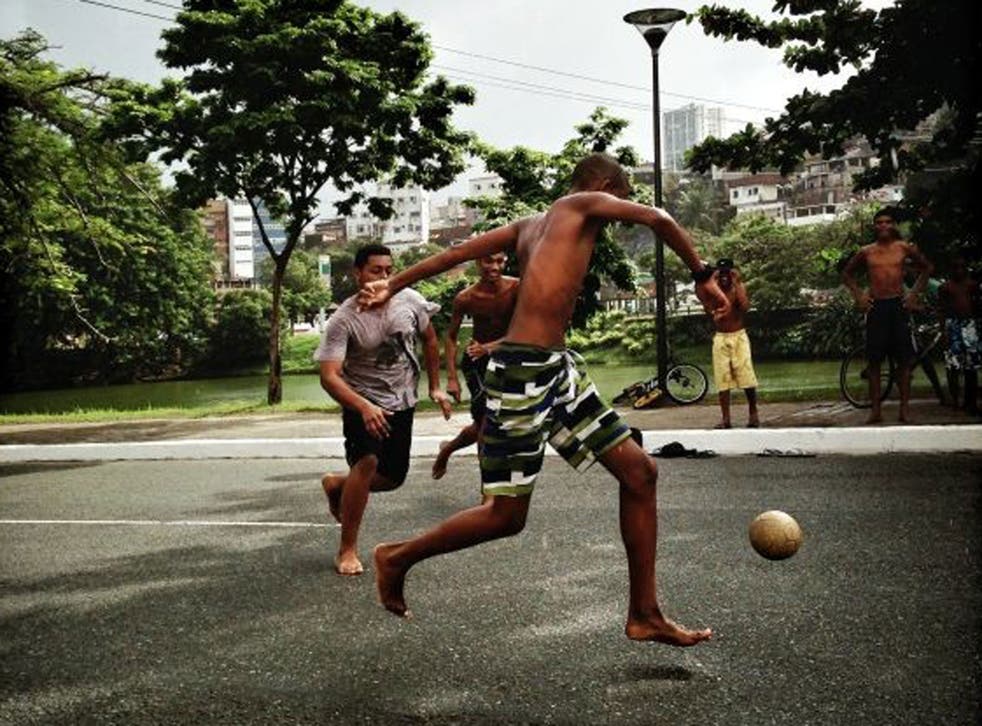 Boys playing street football during the FIFA Confederations Cup Brazil 2013