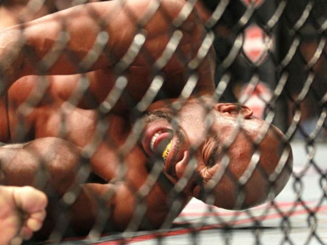 Anderson Silva screams after kicking Chris Weidman and injuring his leg during the UFC 168 mixed martial arts middleweight championship bout on Saturday