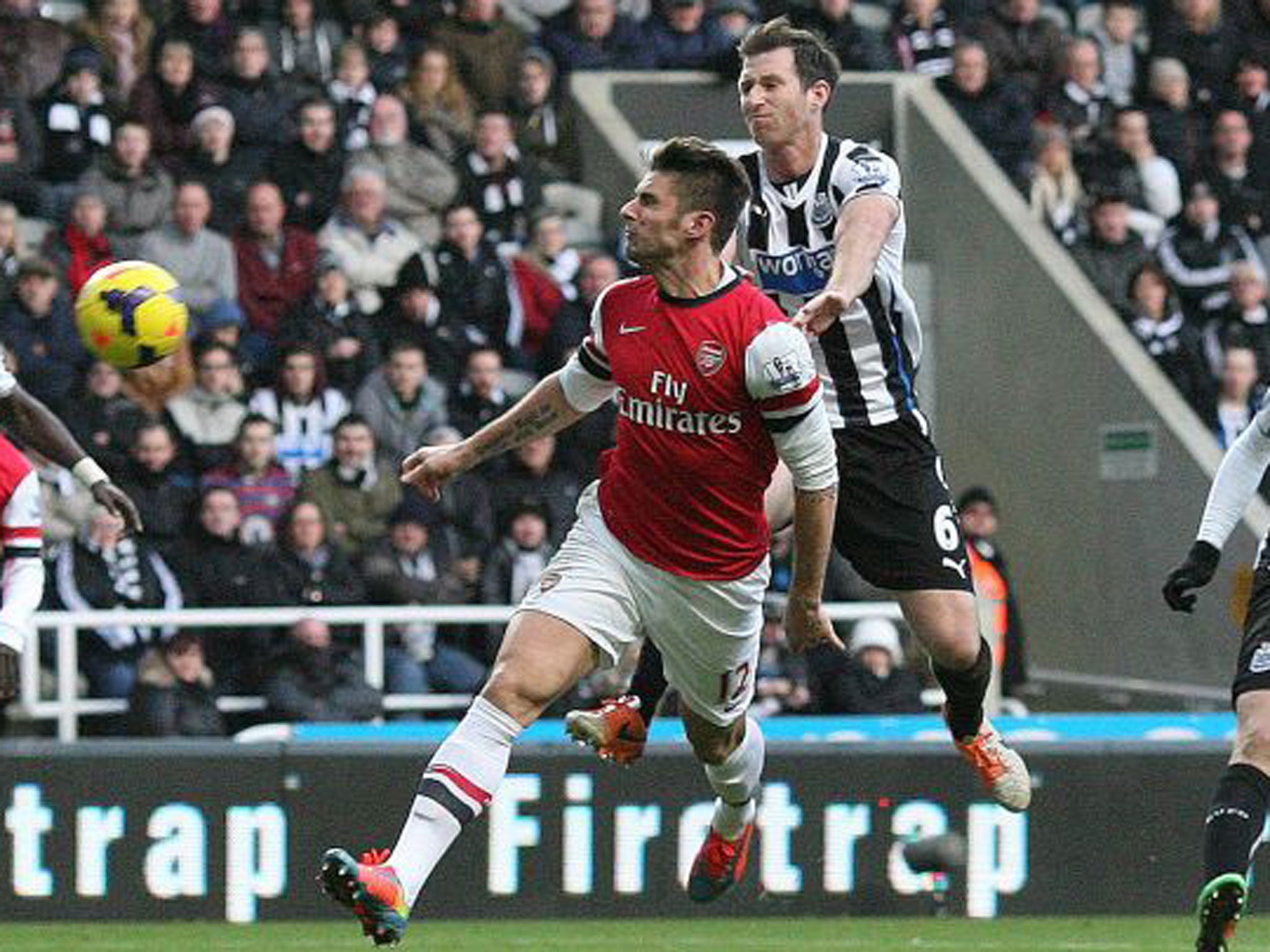 Olivier Giroud (left) heads Arsenal ahead against Newcastle
