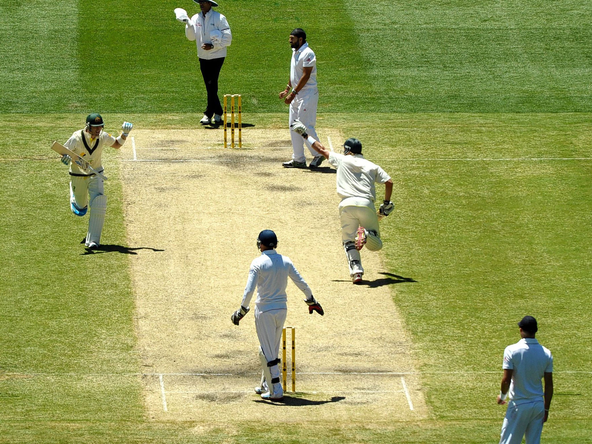 Australia’s Shane Watson (centre right) celebrates hitting the winning runs with Michael Clarke
