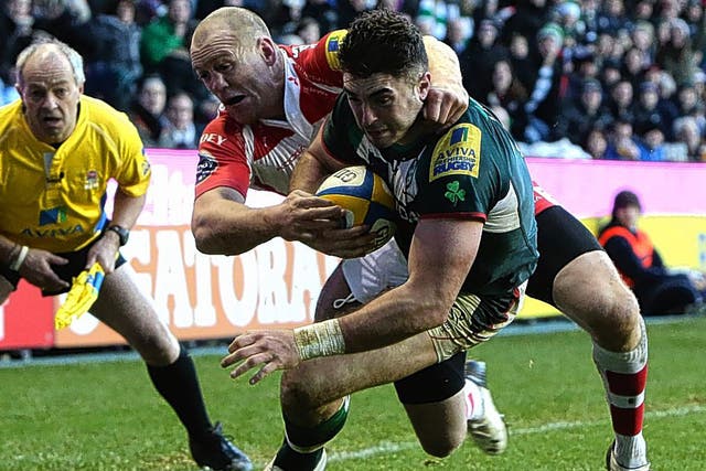 Eamonn Sheridan holds off Gloucester’s Mike Tindall to score his first try for London Irish on Sunday 
