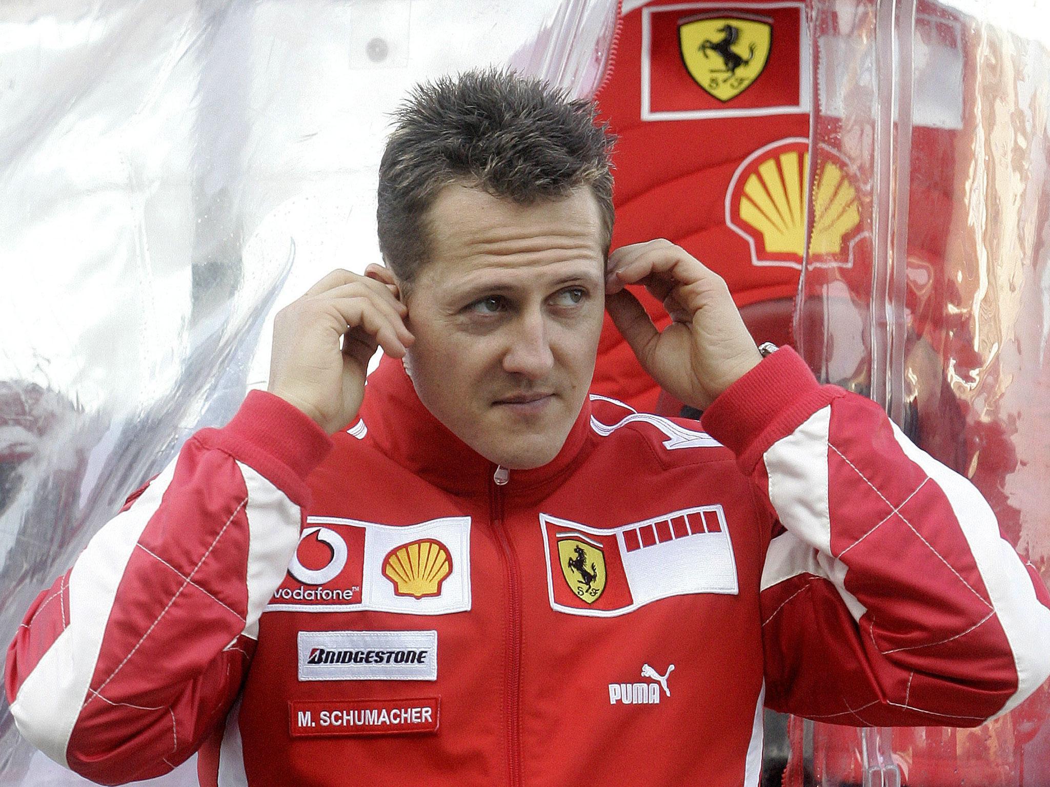 Michael Schumacher is seen in the pits during a training session at the Ricardo Tormo racetrack in Cheste near Valencia in 2006