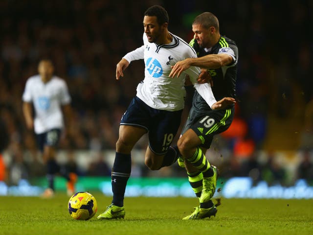 Mousa Dembele of Tottenham competes with Jon Walters of Stoke City