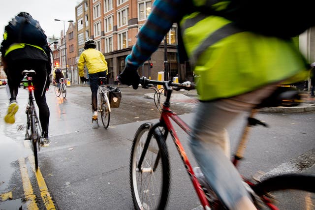 Cyclists ride in central London where the proposed SkyCycle routes would be built