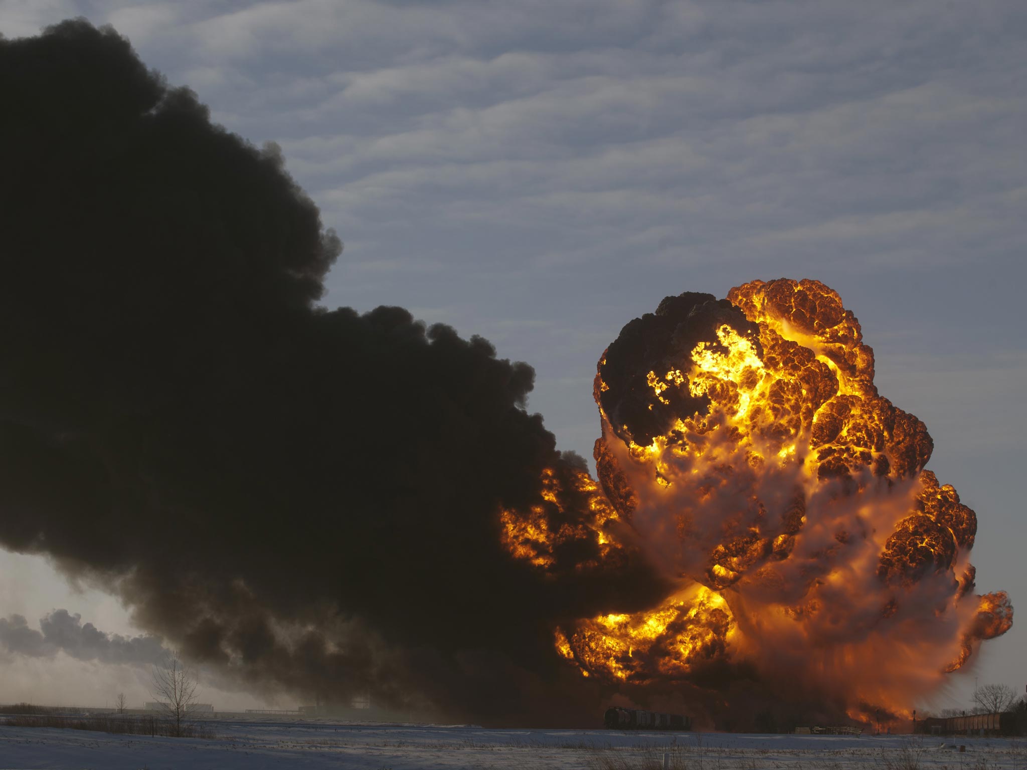 A fireball goes up at the site of an oil train derailment Monday, Dec 30, 2013, in Casselton, North Dakota
