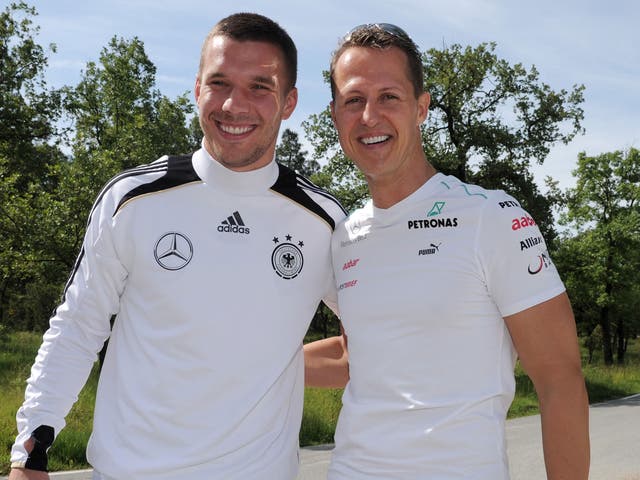 Michael Schuhmacher (right) and Lukas Podolski pictured last year