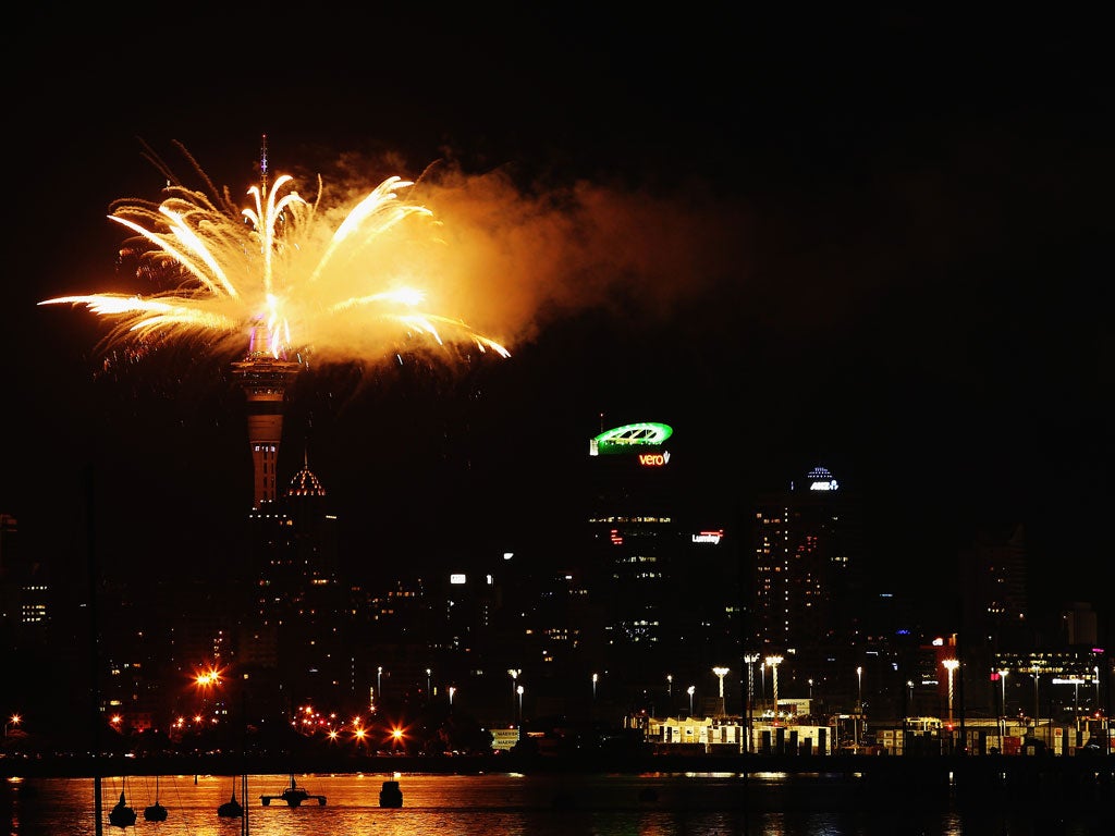 Fireworks are set off from the Auckland Sky Tower in New Zealand to see in 2014