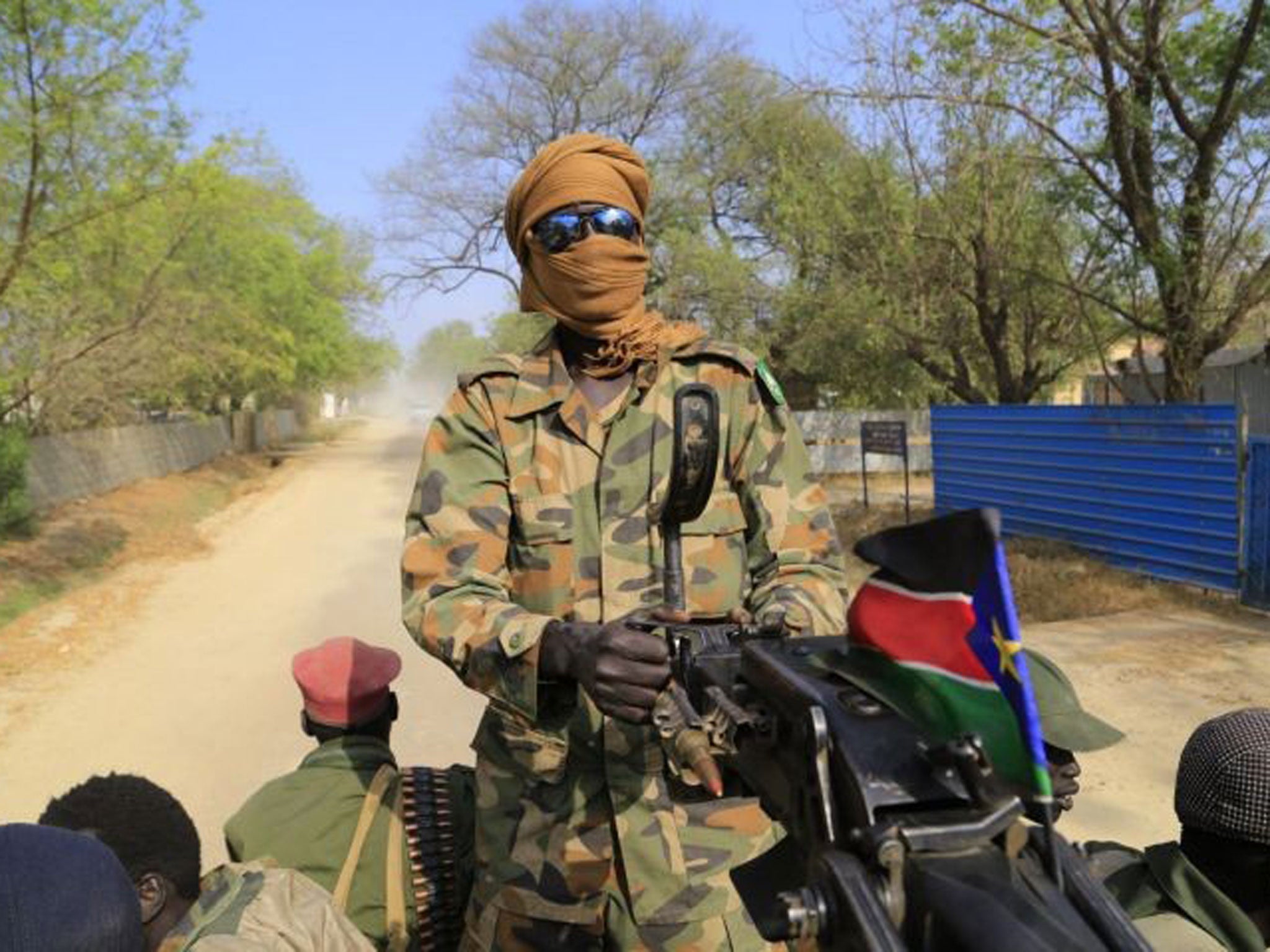 South Sudan army soldier mans a machine gun northeast of the capital Juba. Both sides in the conflict are reported to have agreed a cease fire ahead of peace talks