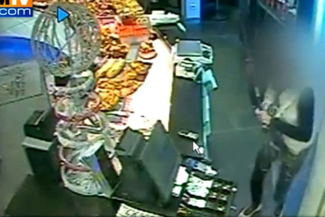 A woman working in a Paris bakery has driven away an armed robber with nothing but a broom