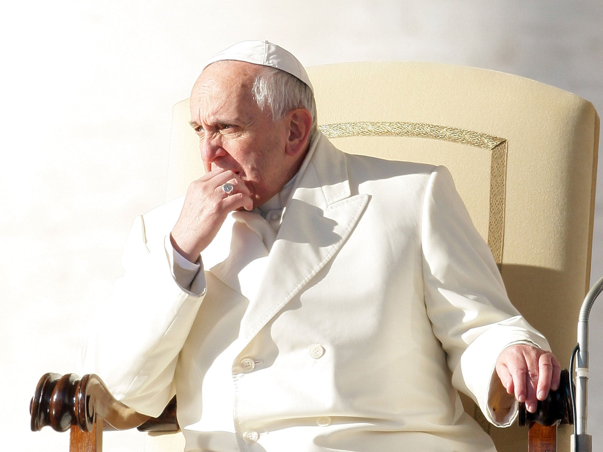 Pope Francis battles the cold wearing all-white