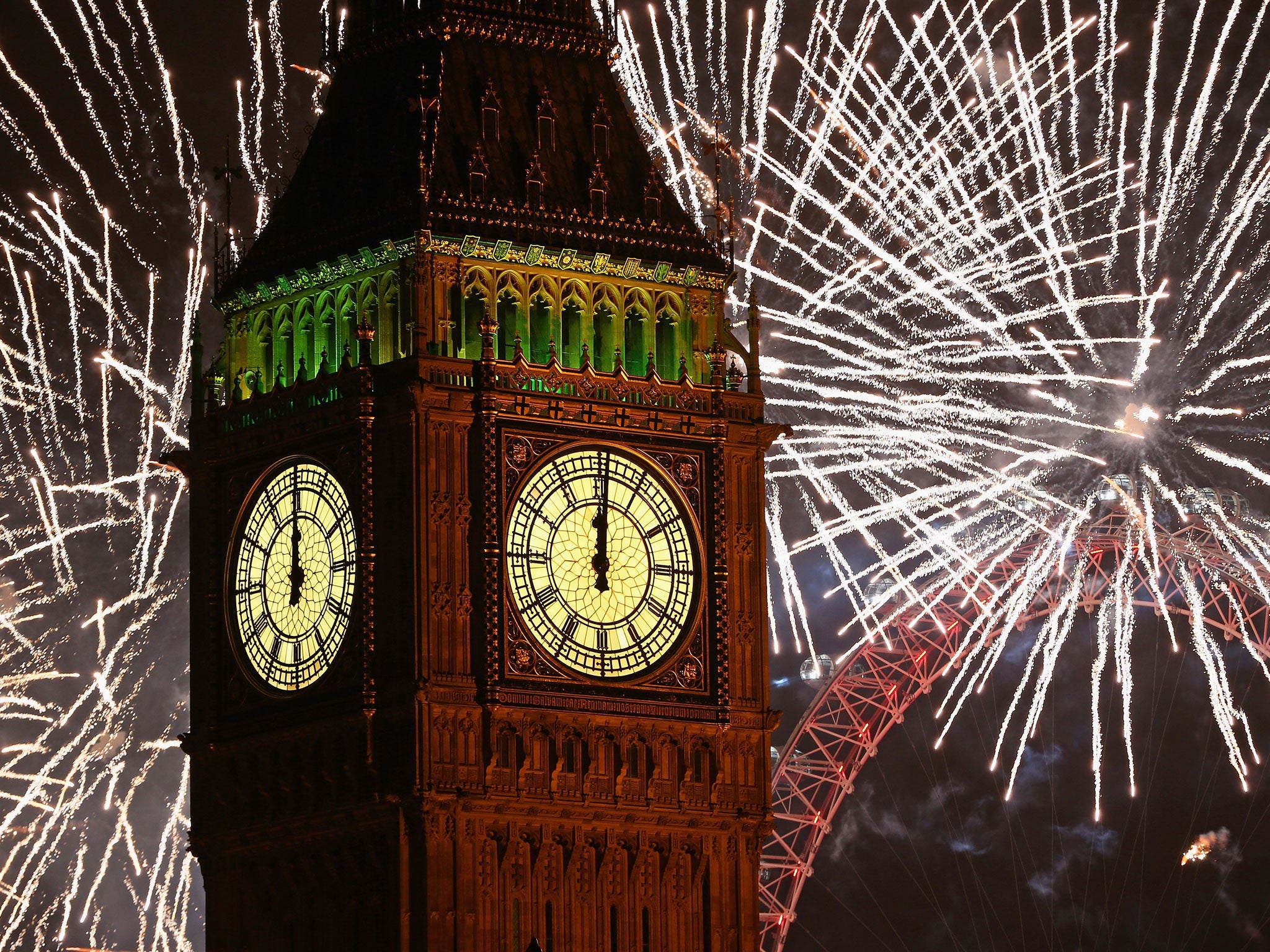 Fireworks light up Big Ben just after midnight