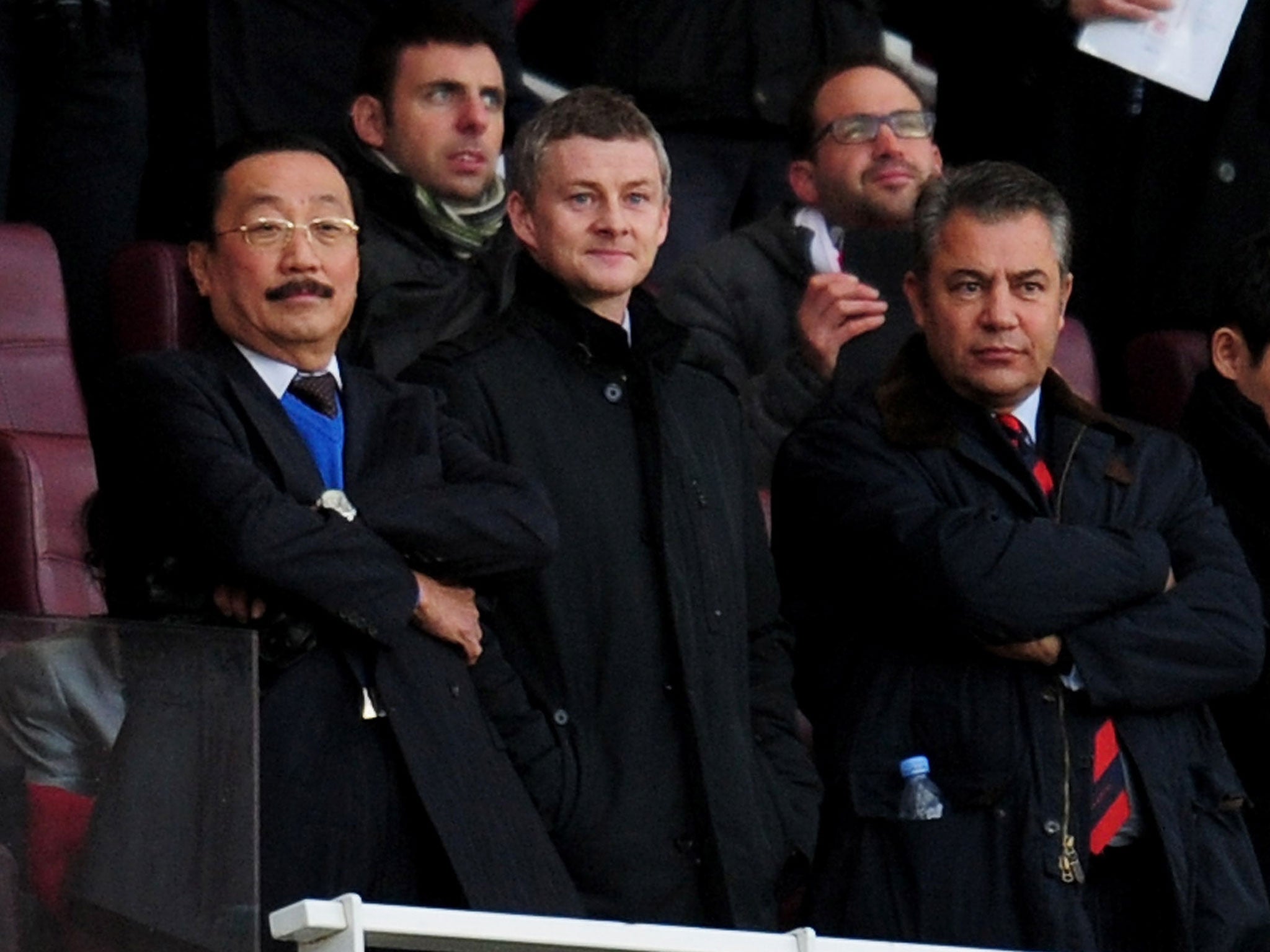 Molde manager Ole Gunnar Solskjaer (second from left) and Cardiff City owner Vincent Tan (left) look on from the stands at the Emirates Stadium on New Year's Day