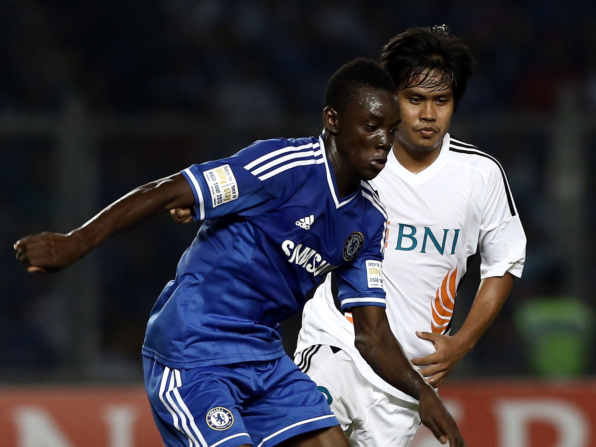 Bertrand Traore of Chelsea is pursued by Rizky Pellu of Indonesia All-Stars during the match between Chelsea and Indonesia All-Stars at Gelora Bung Karno Stadium on July 25