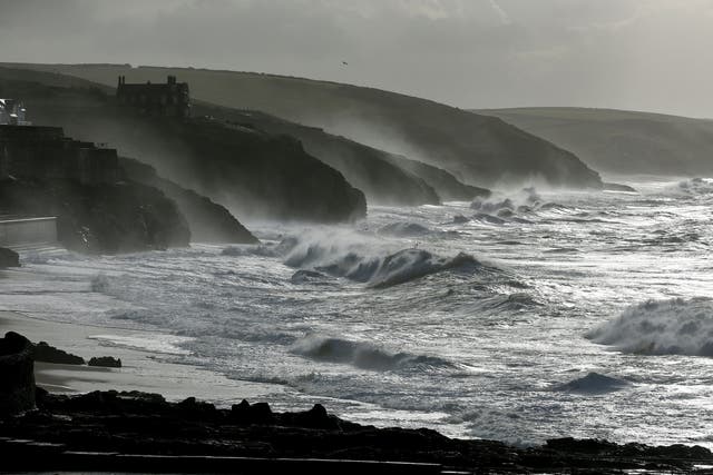Large waves break along the coast at Porthleven, Cornwall where a 26-year-old man went missing on New Year's Eve. 