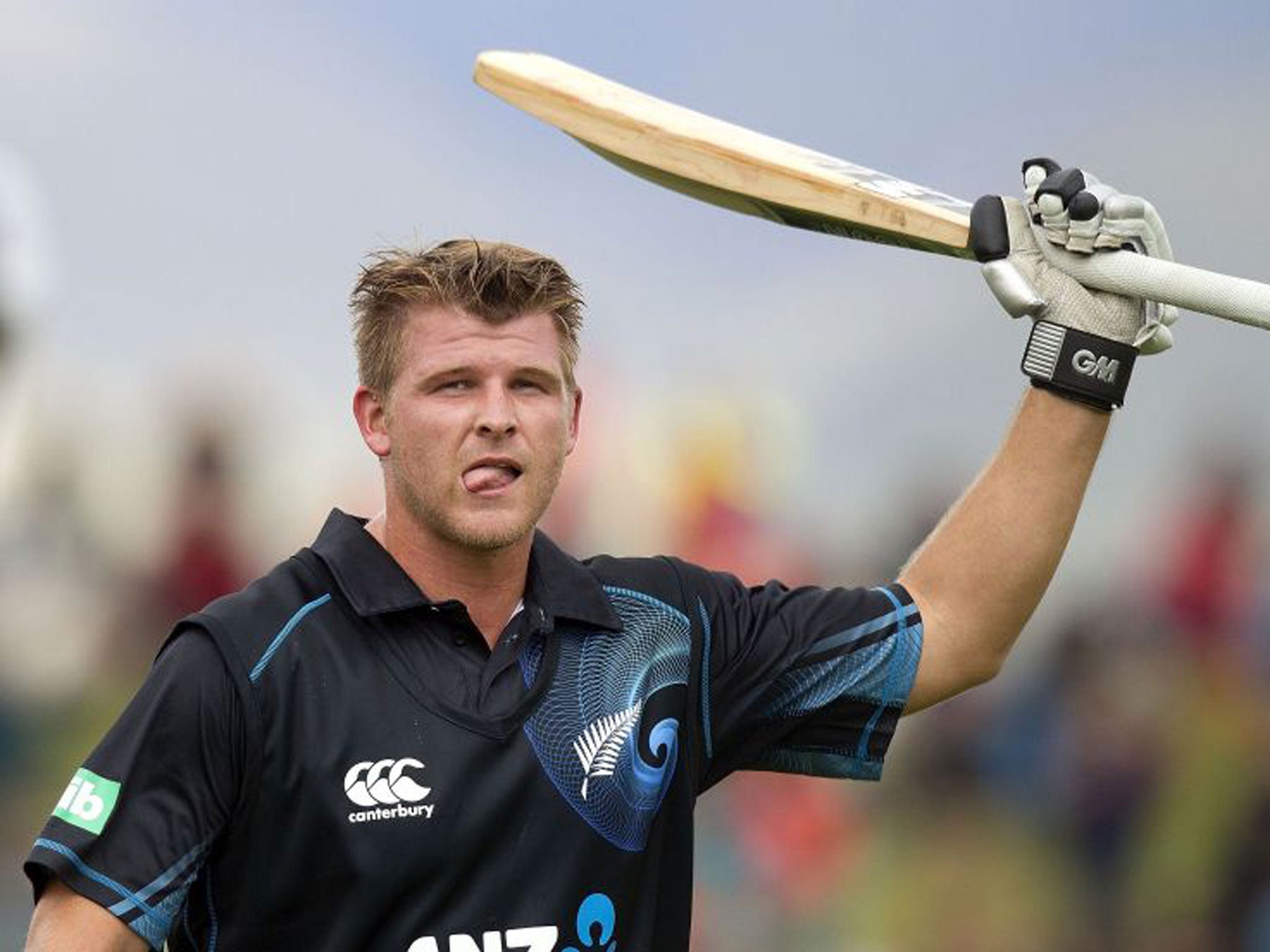 Corey Anderson celebrates after scoring the fastest century in history
