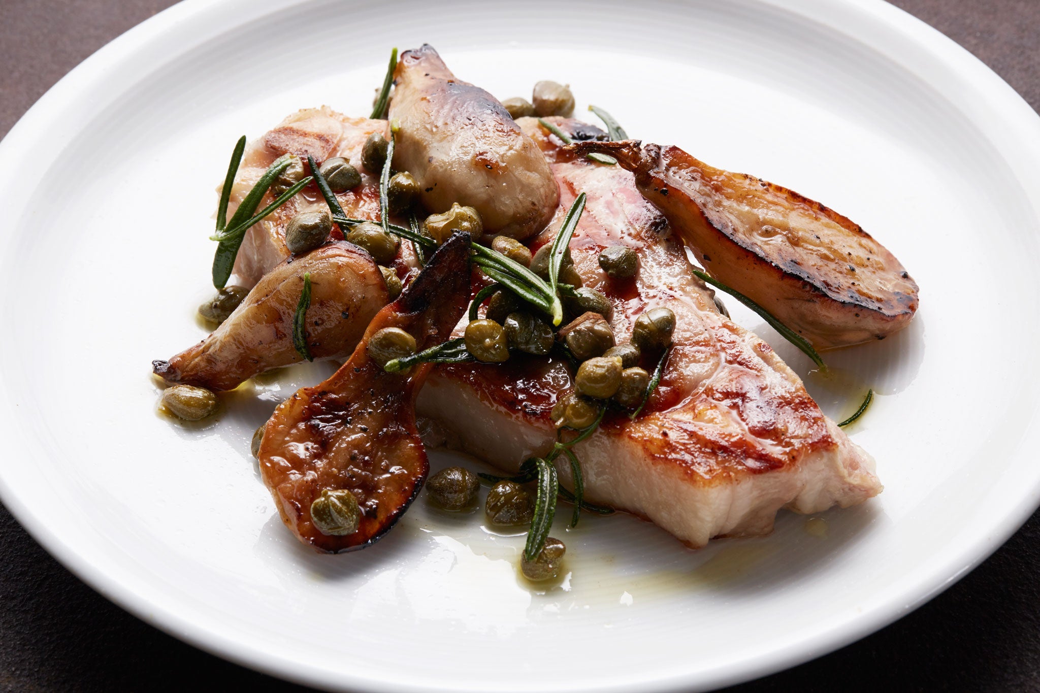 Grilled veal chop with Jerusalem artichokes, capers and rosemary