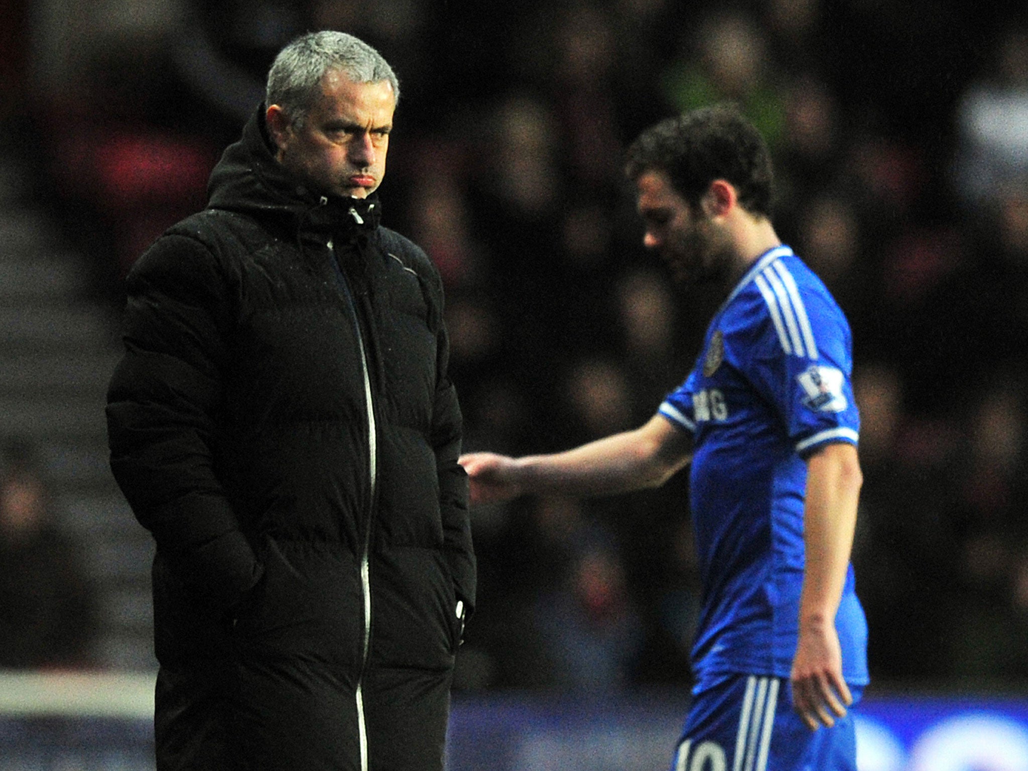 Jose Mourinho and Juan Mata avoid making eye contact after the latter is substituted during the 3-0 victory over Southampton