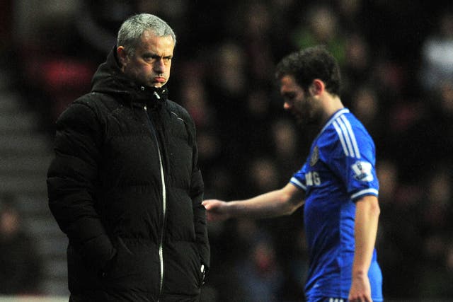 Jose Mourinho and Juan Mata avoid making eye contact after the latter is substituted during the 3-0 victory over Southampton