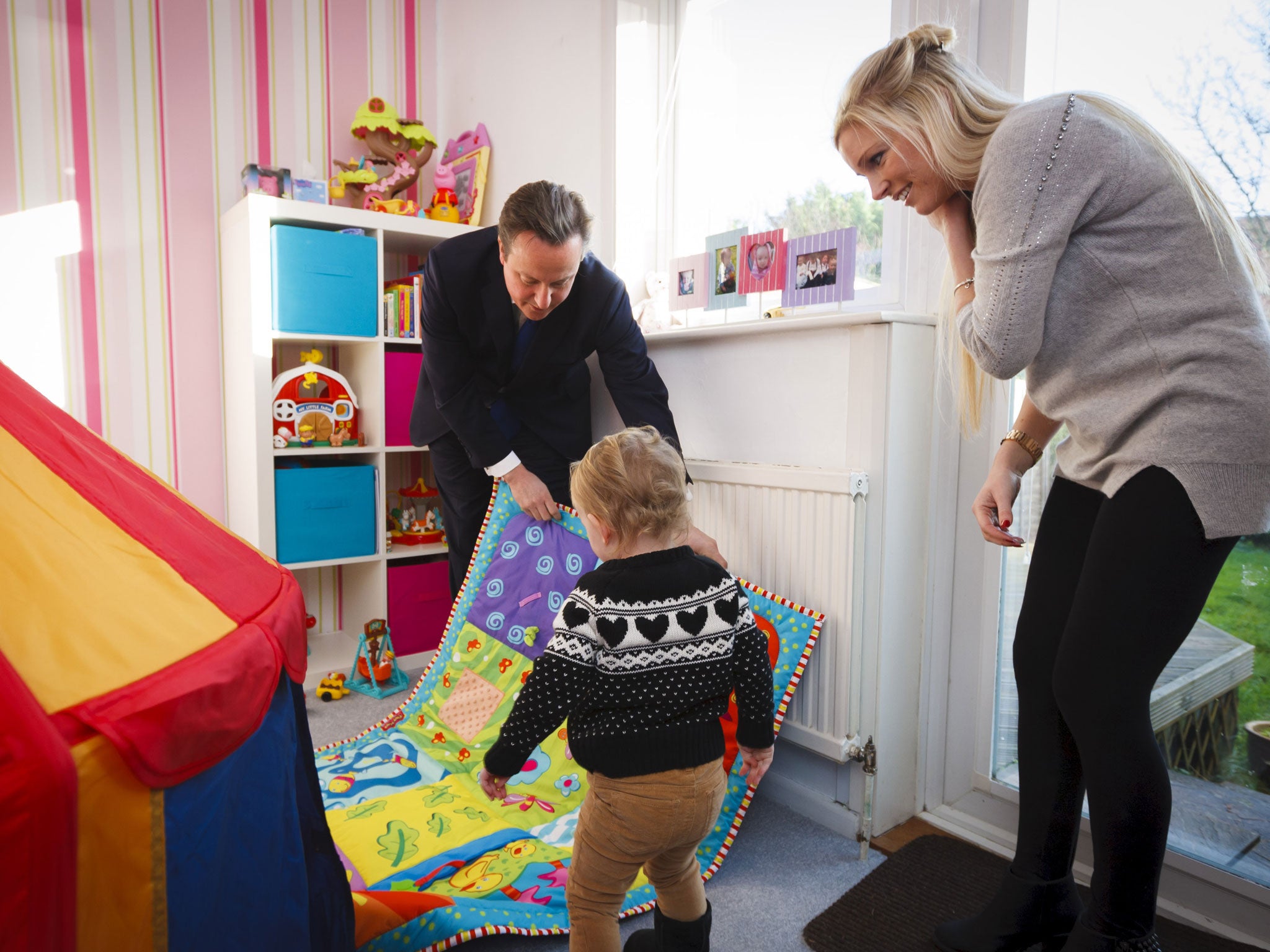 Prime Minister David Cameron with Sharon Ray and her daughter Maisie, 2, during a visit to her home in Southampton, Hampshire which she has bought through the government's Help to Buy scheme