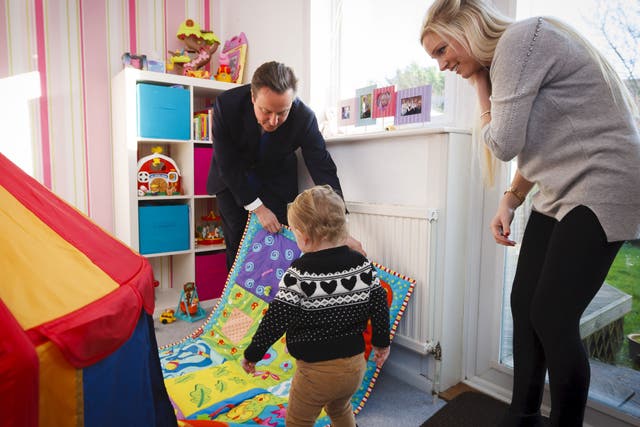 Prime Minister David Cameron with Sharon Ray and her daughter Maisie, 2, during a visit to her home in Southampton, Hampshire which she has bought through the government's Help to Buy scheme