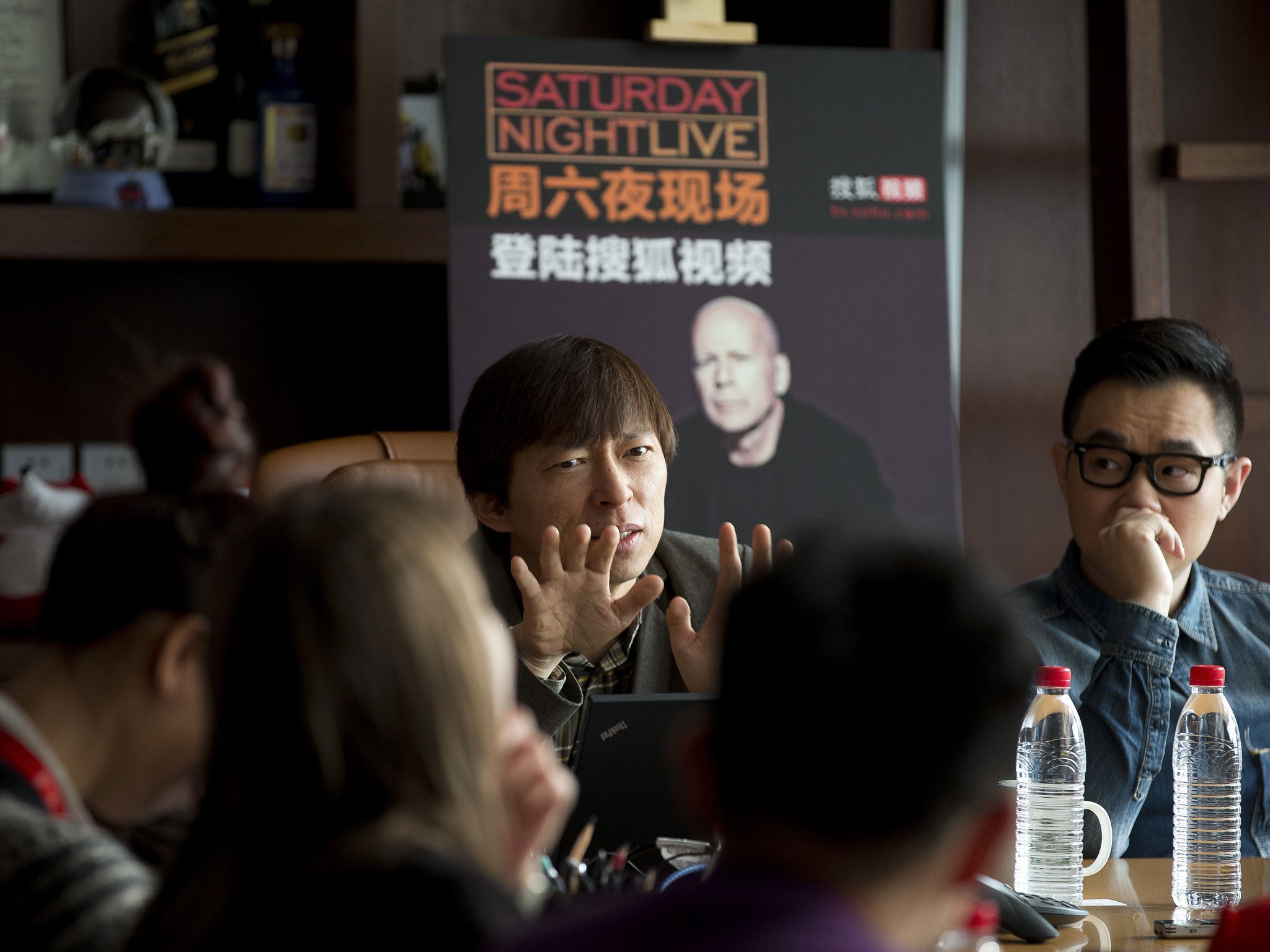Charles Zhang speaks to journalists during a press conference in Beijing