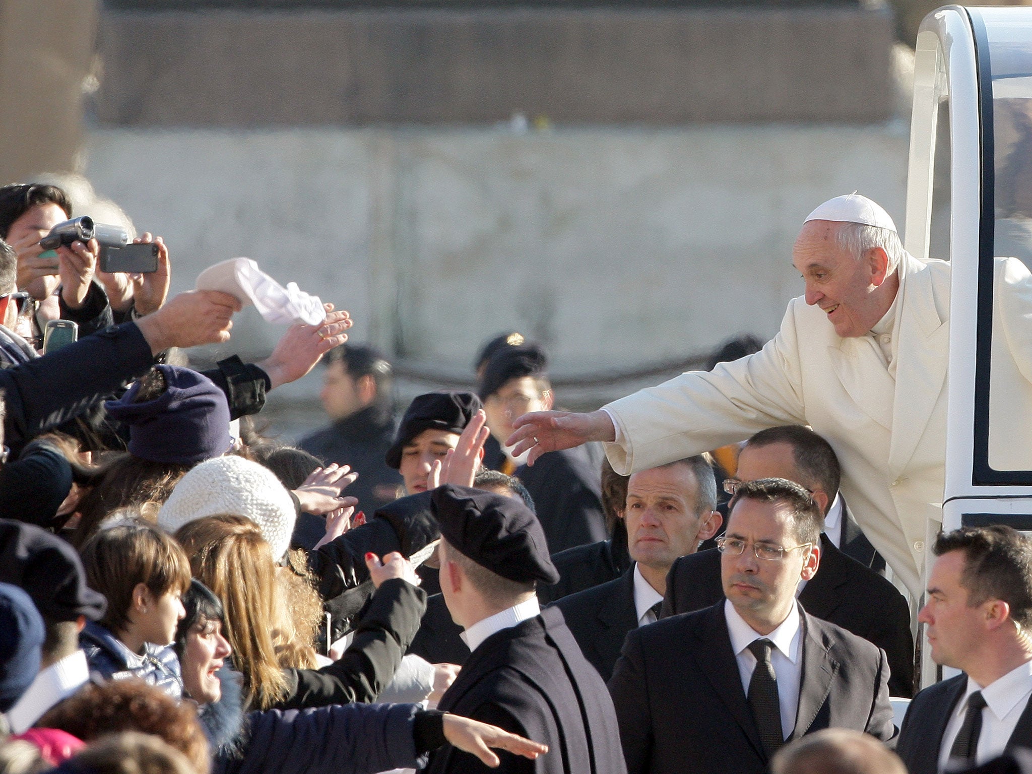 Pope Francis greets the crowd at his weekly Audience in St. Peter's Square in Vatican City.