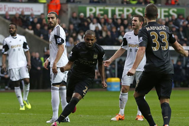 Fernandinho celebrates after scoring the first goal in Manchester City's 3-2 victory over Swansea