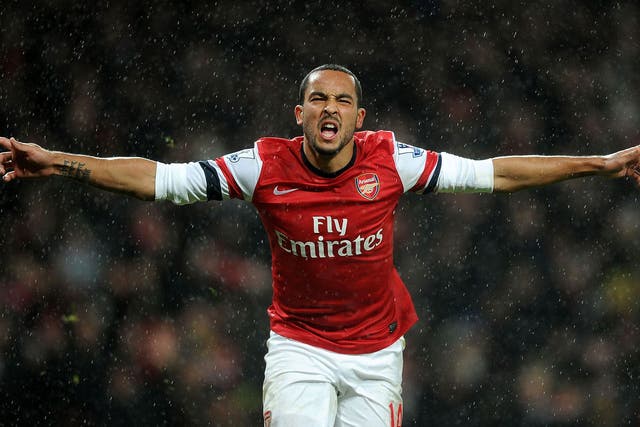 Theo Walcott celebrates after scoring the second goal in the 2-0 victory over Cardiff City