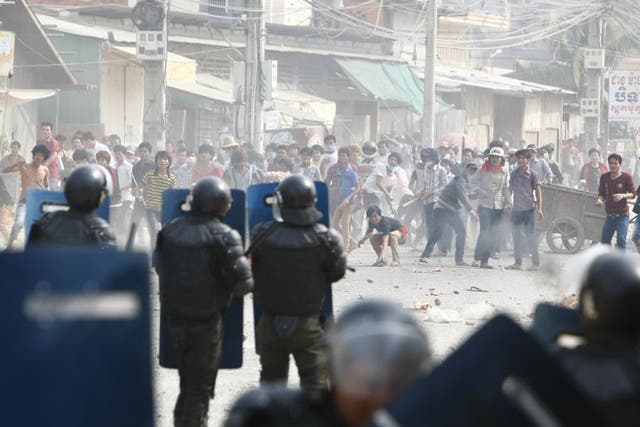 Cambodian riot police prepare to blockade garment workers during a strike near a factory of Canadia Centre, on the Stung Meanchey complex at the outskirt of  Phnom Penh