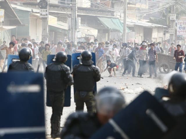 Cambodian riot police prepare to blockade garment workers during a strike near a factory of Canadia Centre, on the Stung Meanchey complex at the outskirt of  Phnom Penh