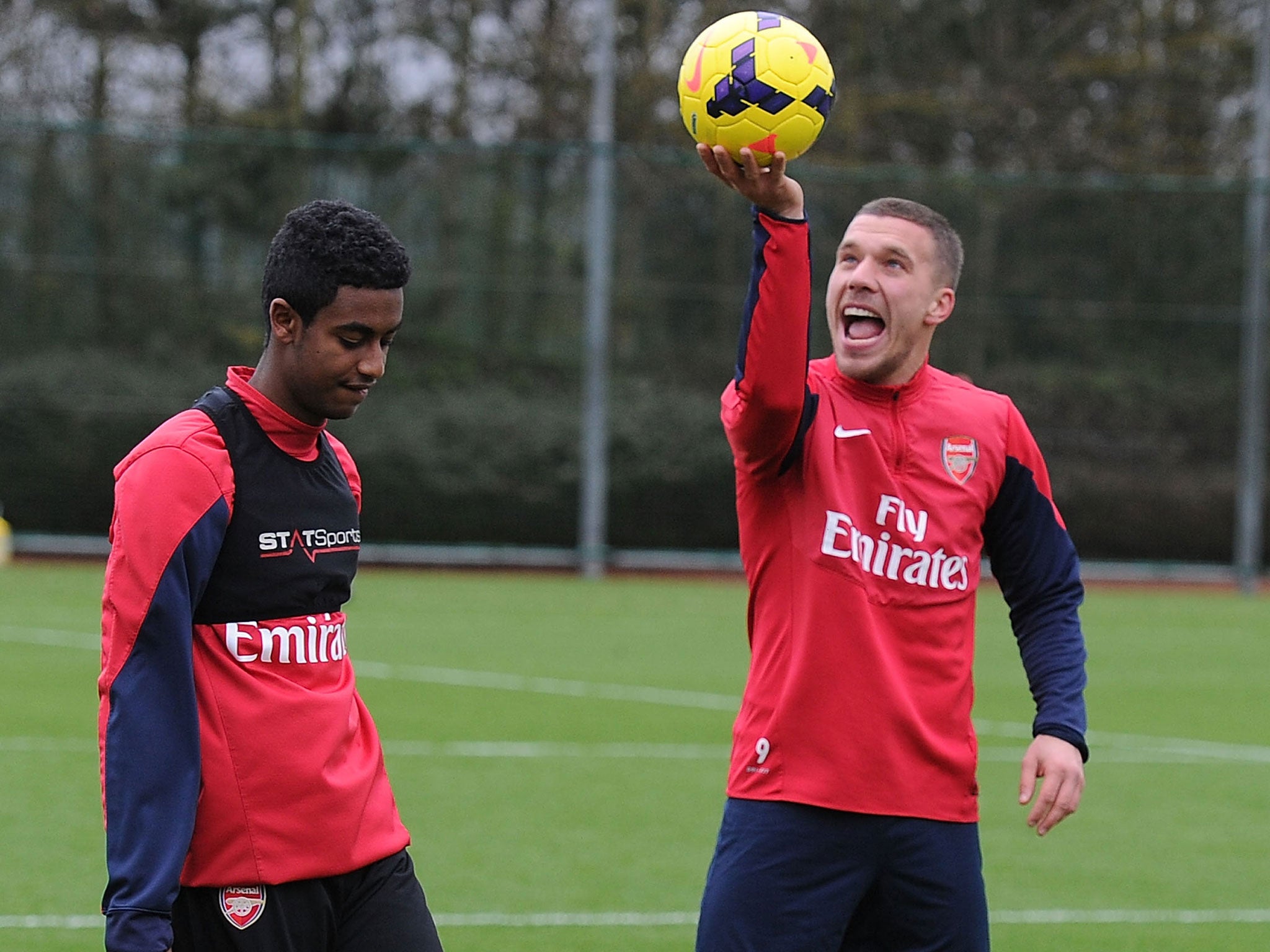 Gedion Zelalem (left) with Arsenal team-mate Lukas Podolski during training this week