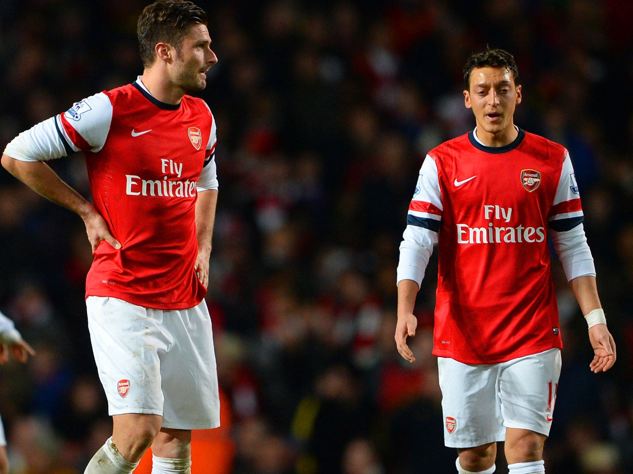 Olivier Giroud (left) and Mesut Ozil are doubtful for the Tottenham fixture on Saturday