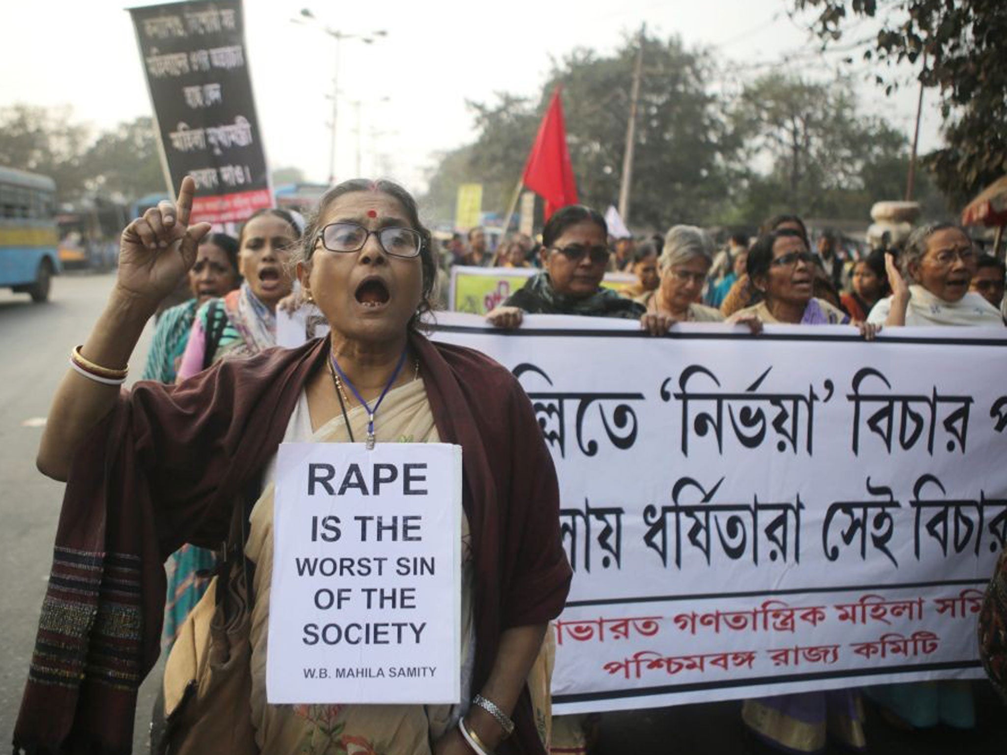 West Bengal Women's Forum activists walk a protest rally against a rape case in Calcutta, eastern India on 03 January 2014. A young girl was gang-raped on October 25 and afterwards repeatedly threatened by the accused, following which the disturbed girl s