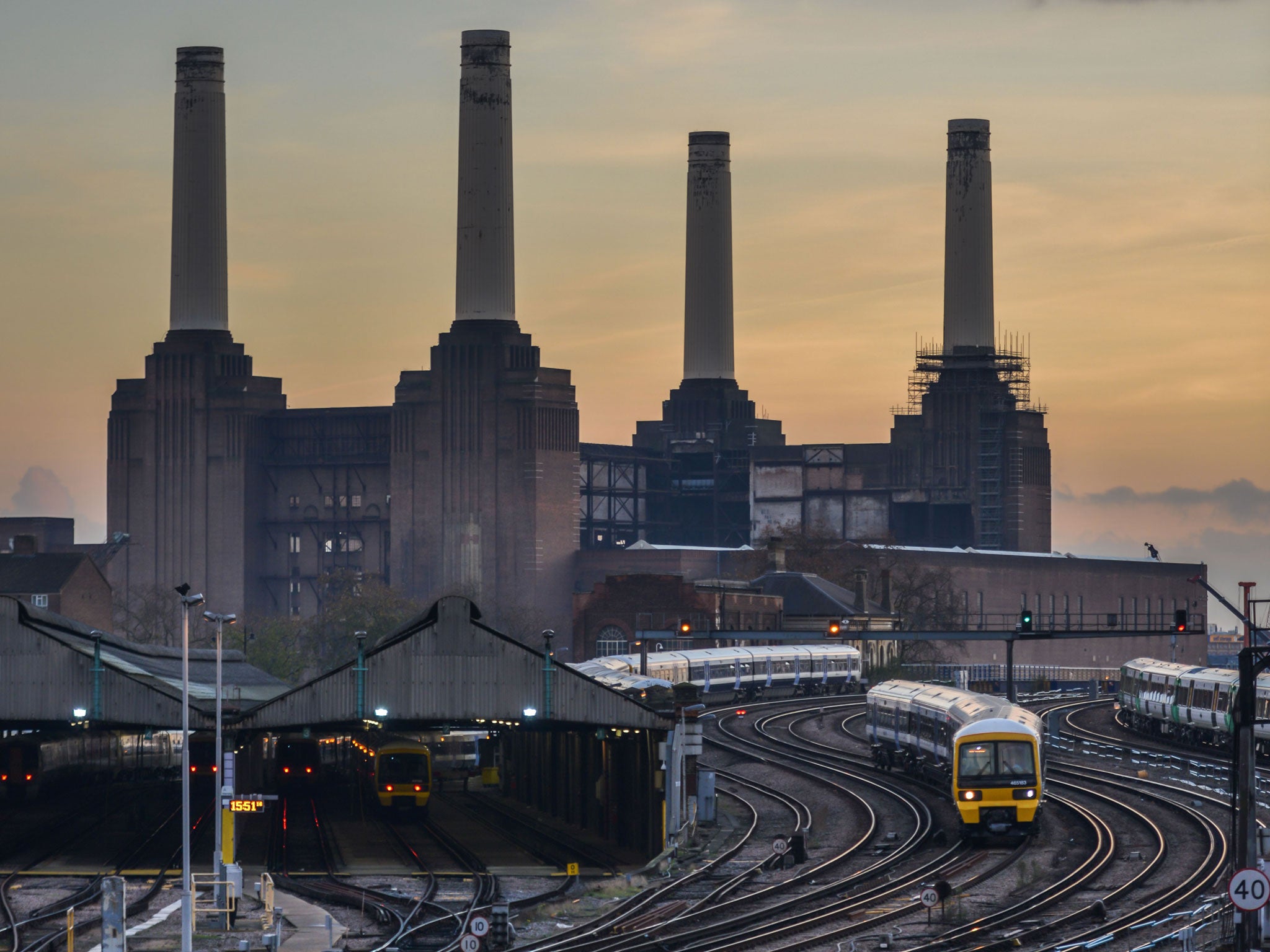 A train passes Battersea power station en route to London Victoria. Unlike on the Continent, only 58 per cent of UK railway running costs come from fares