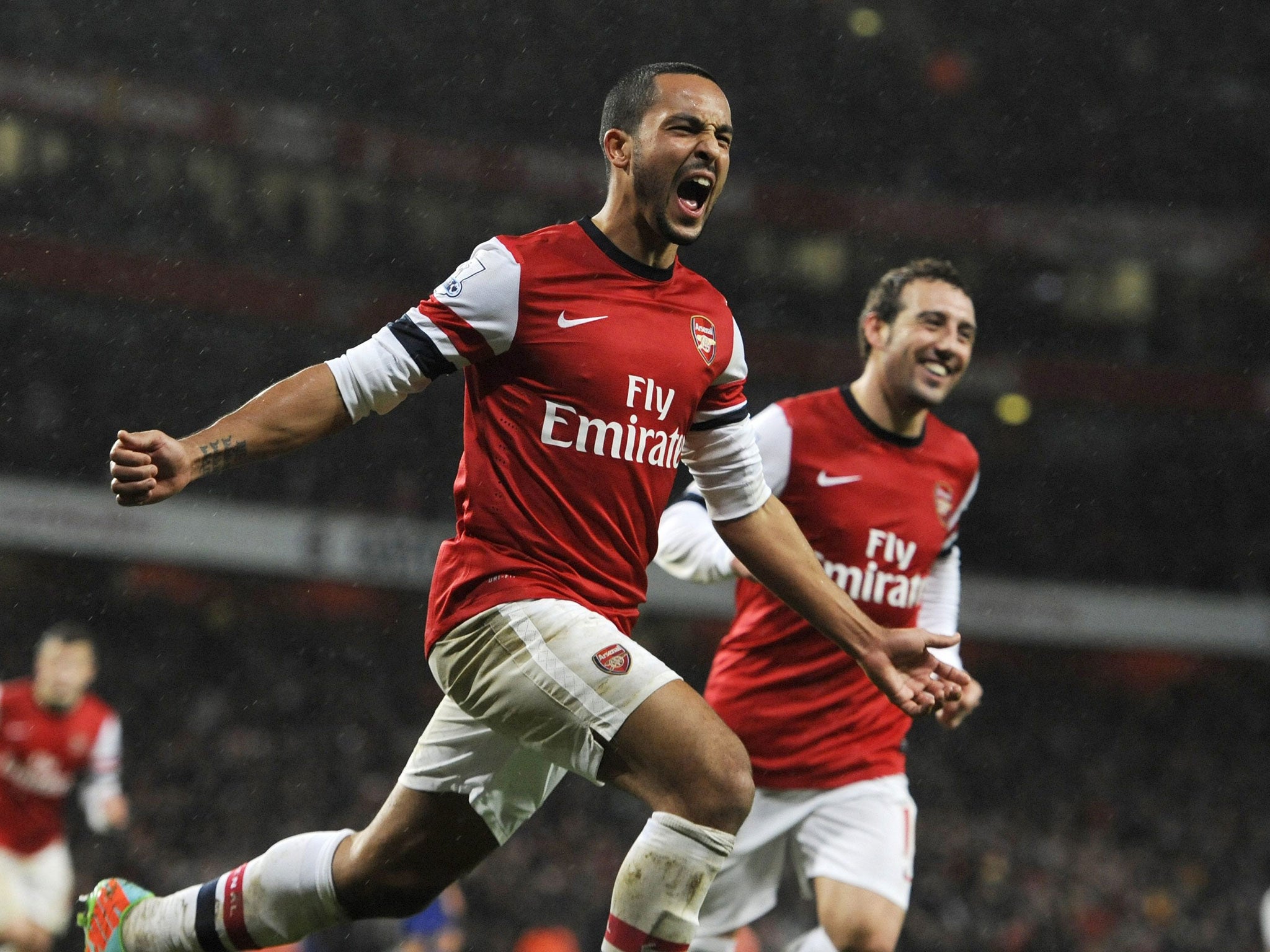 Arsenal's Theo Walcott celebrates his goal against Cardiff