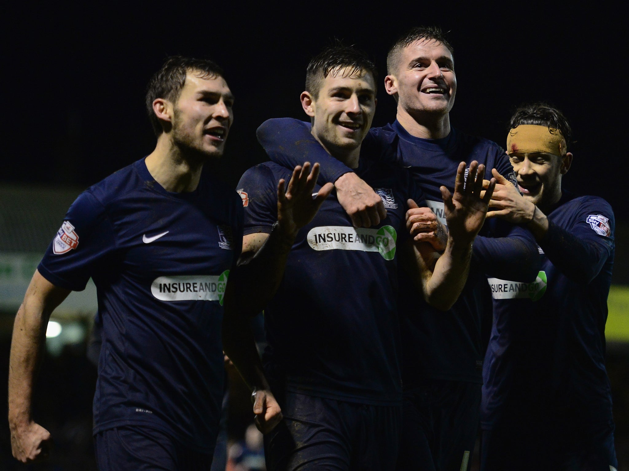 Southend players celebrate scoring against Millwall in their 4-1 victory