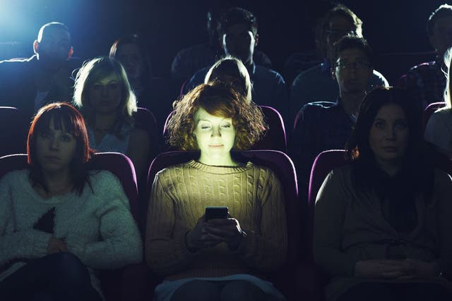 Cinema-goers may now be asked to keep their phones on, as a new app is trialed  