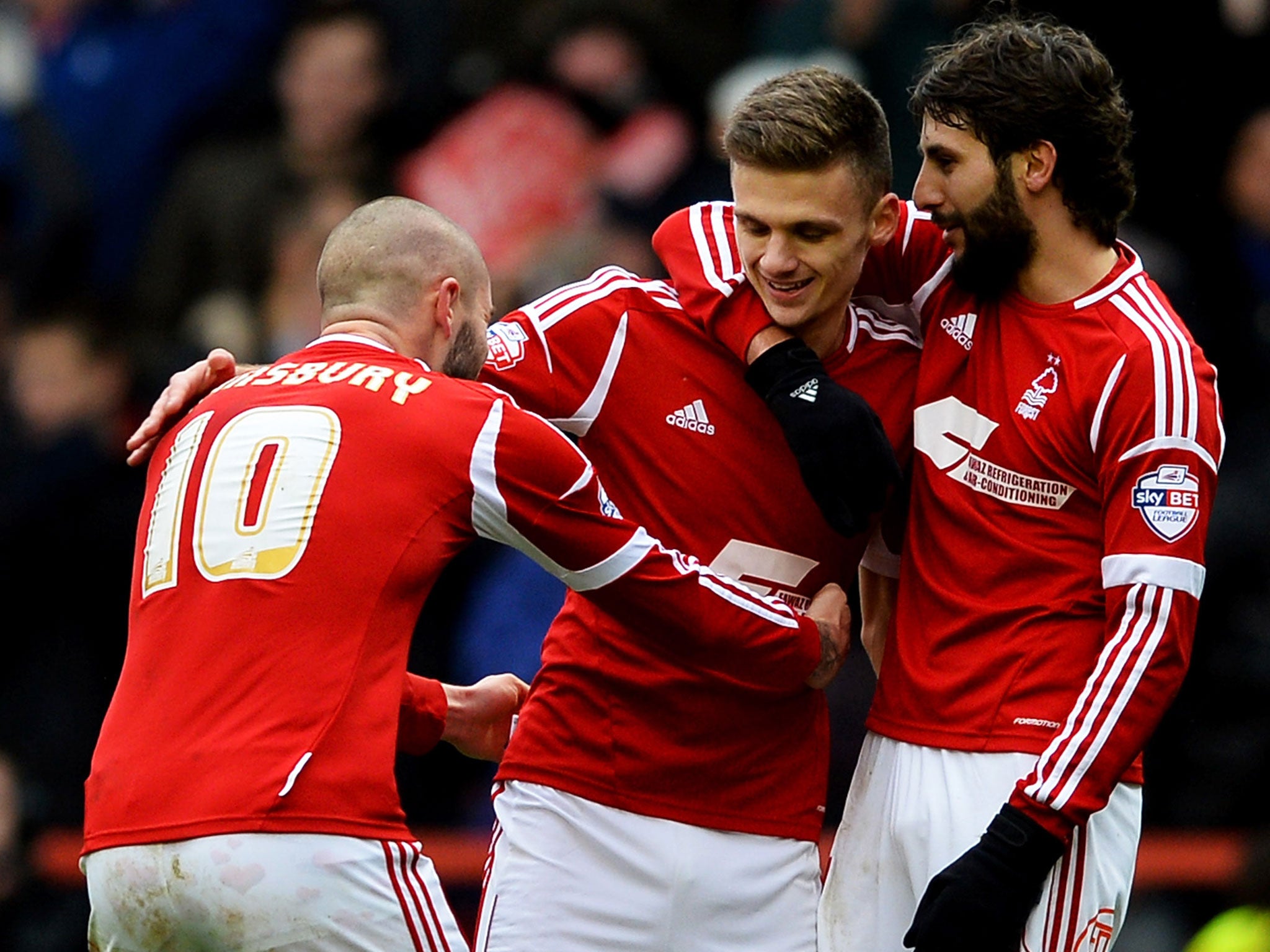 Jamie Paterson (centre) celebrates the second of his hat-trick