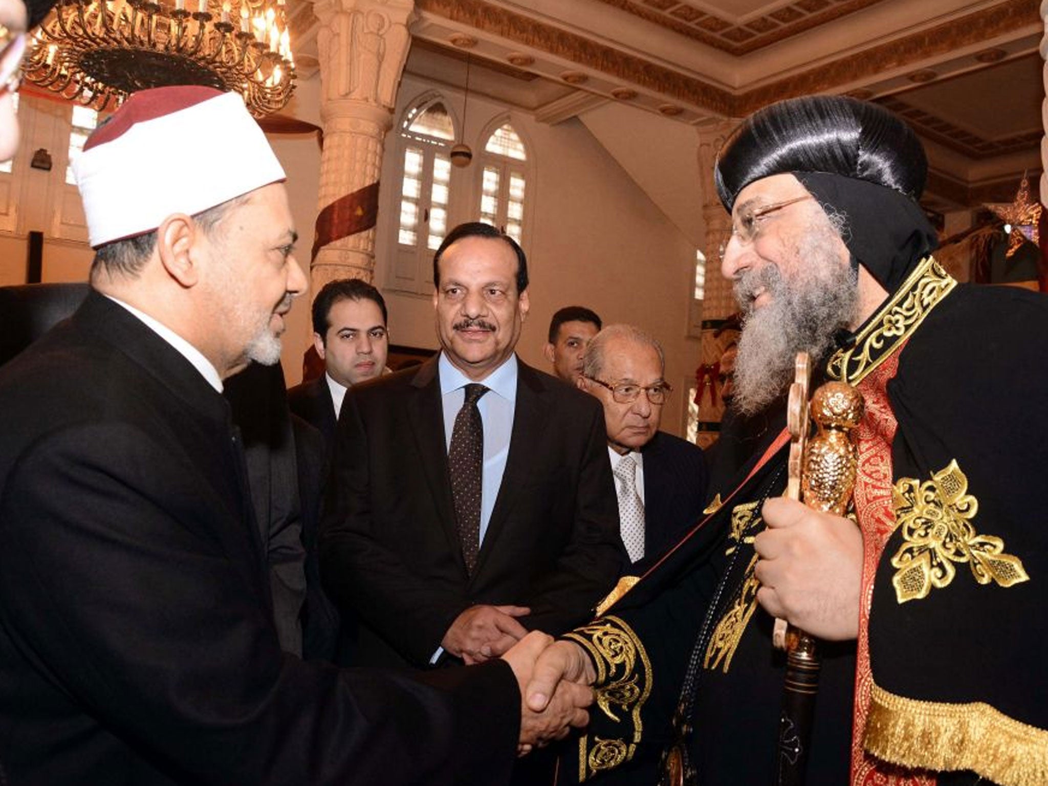 Leader of the Egyptian Coptic Orthodox Church, Pope Tawadros II (right), welcomes Grand Imam of Al-Azhar, Sheikh Ahmed el-Tayeb, in Cairo, Egypt