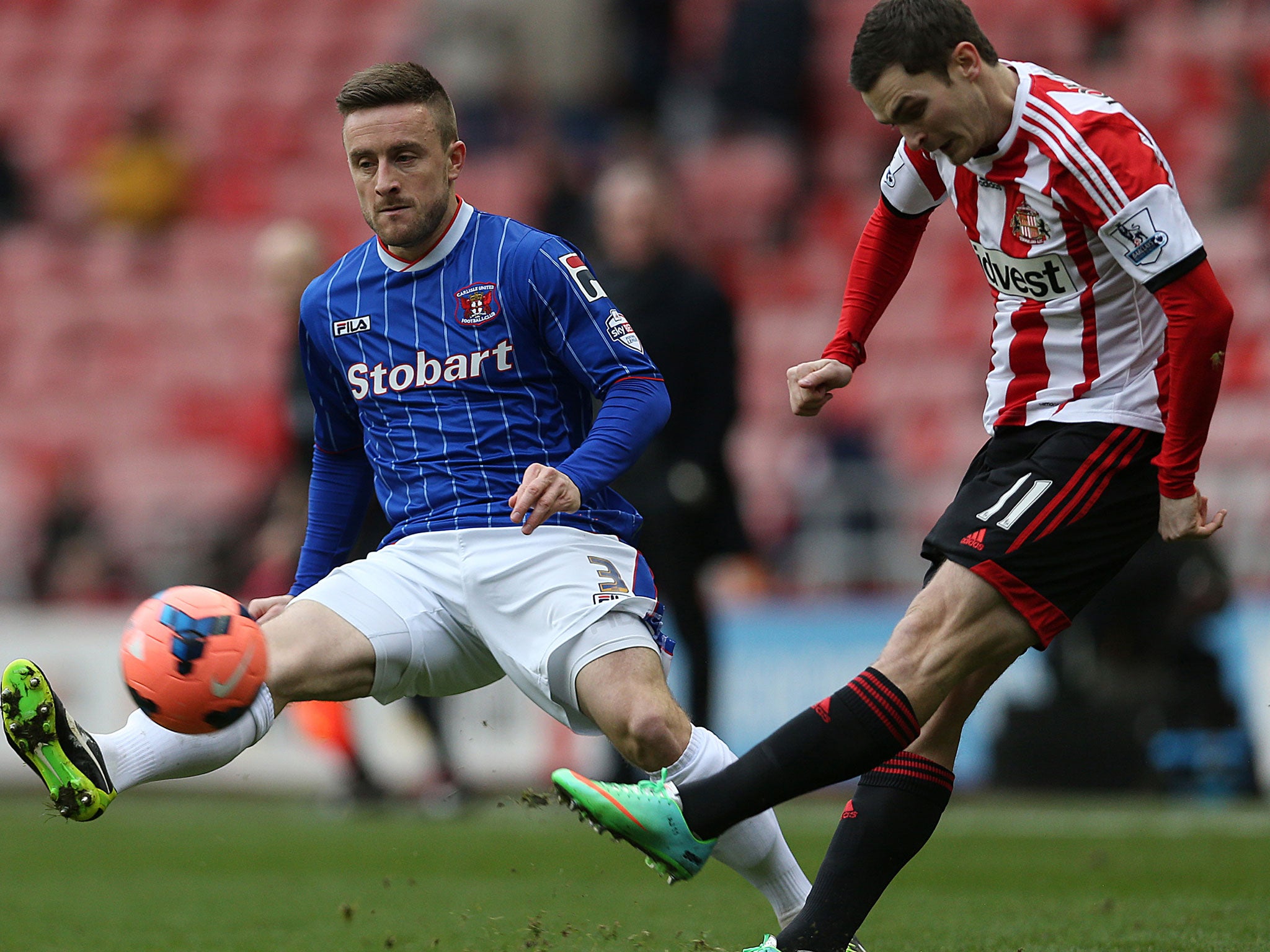 Carlisle United's Matty Robson (left) vies with Sunderland's Adam Johnson in the FA Cup clash on Sunday
