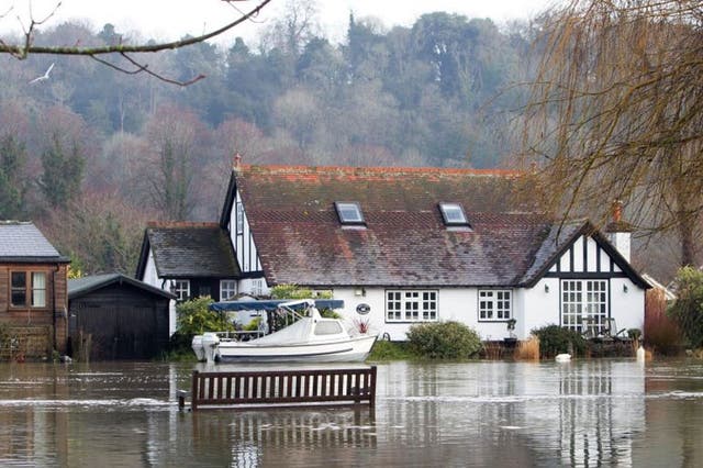 Houses next to the River Thames in Henley-on-Thames, Berkshire are flooded after the river burst its banks