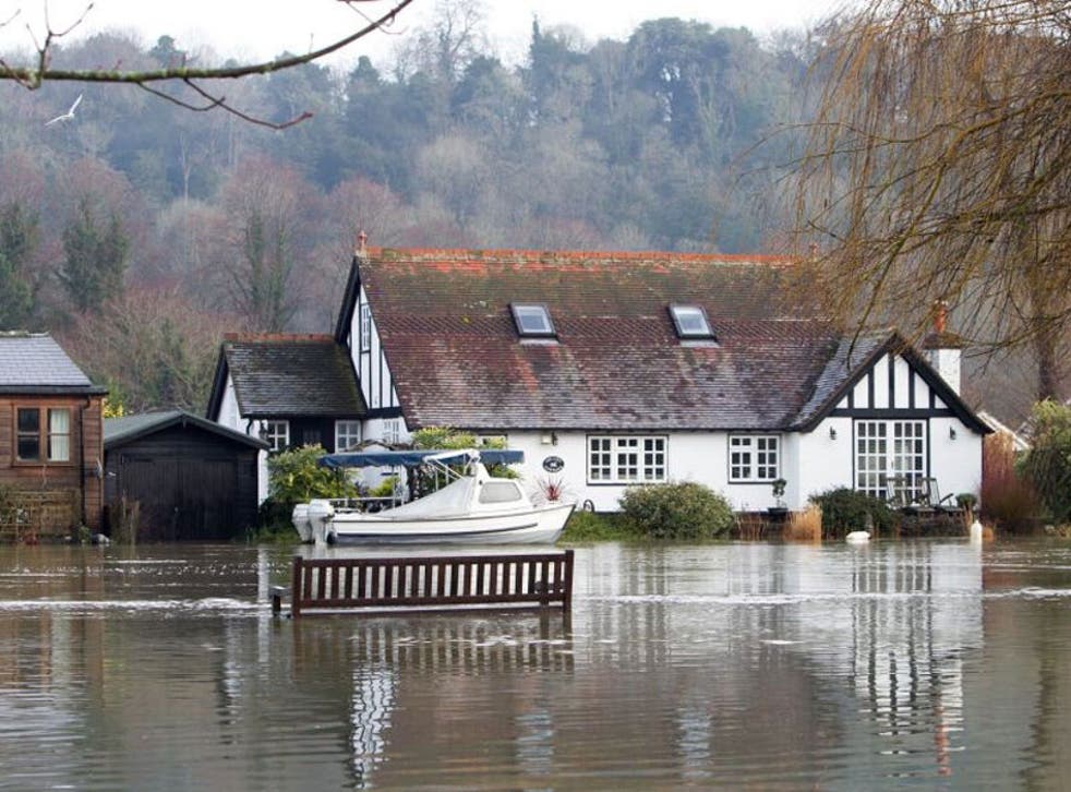 Houses next to the River Thames in Henley-on-Thames, Berkshire are flooded after the river burst its banks