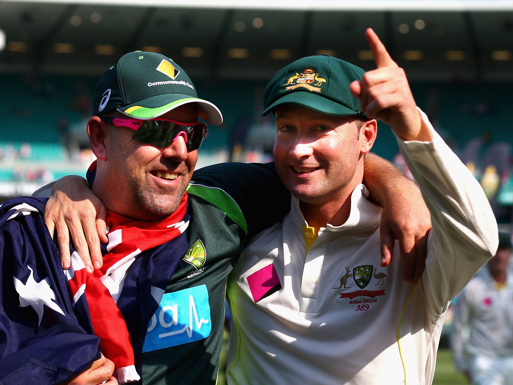 Darren Lehmann (left) celebrates the Ashes triumph with captain Michael Clarke