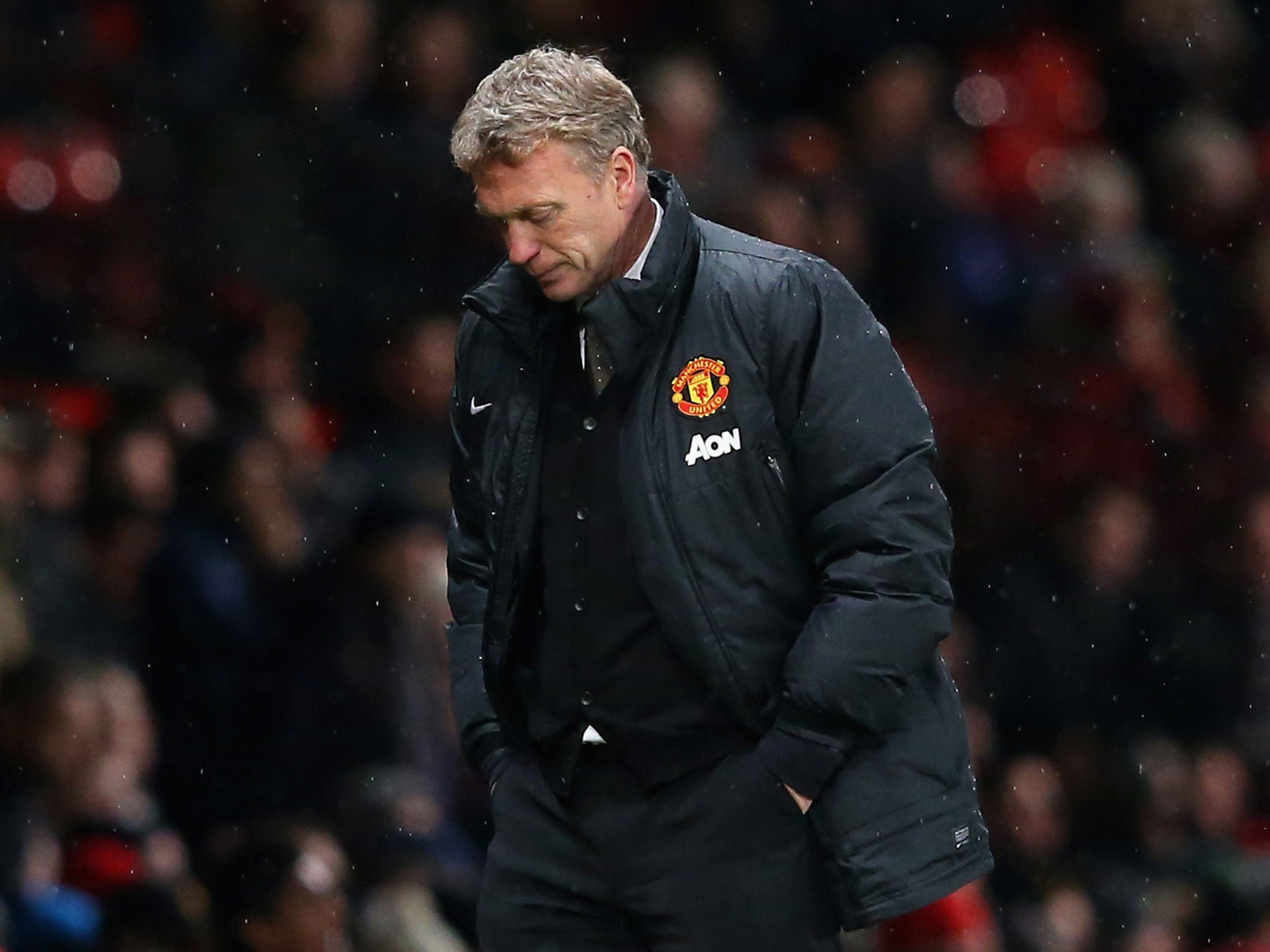 Manchester United manager David Moyes looks on in downbeat fashion during his club's 2-1 defeat by Swansea