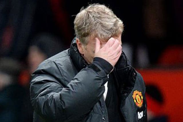 Manchester United manager David Moyes walks off the pitch dejected after the final whistle