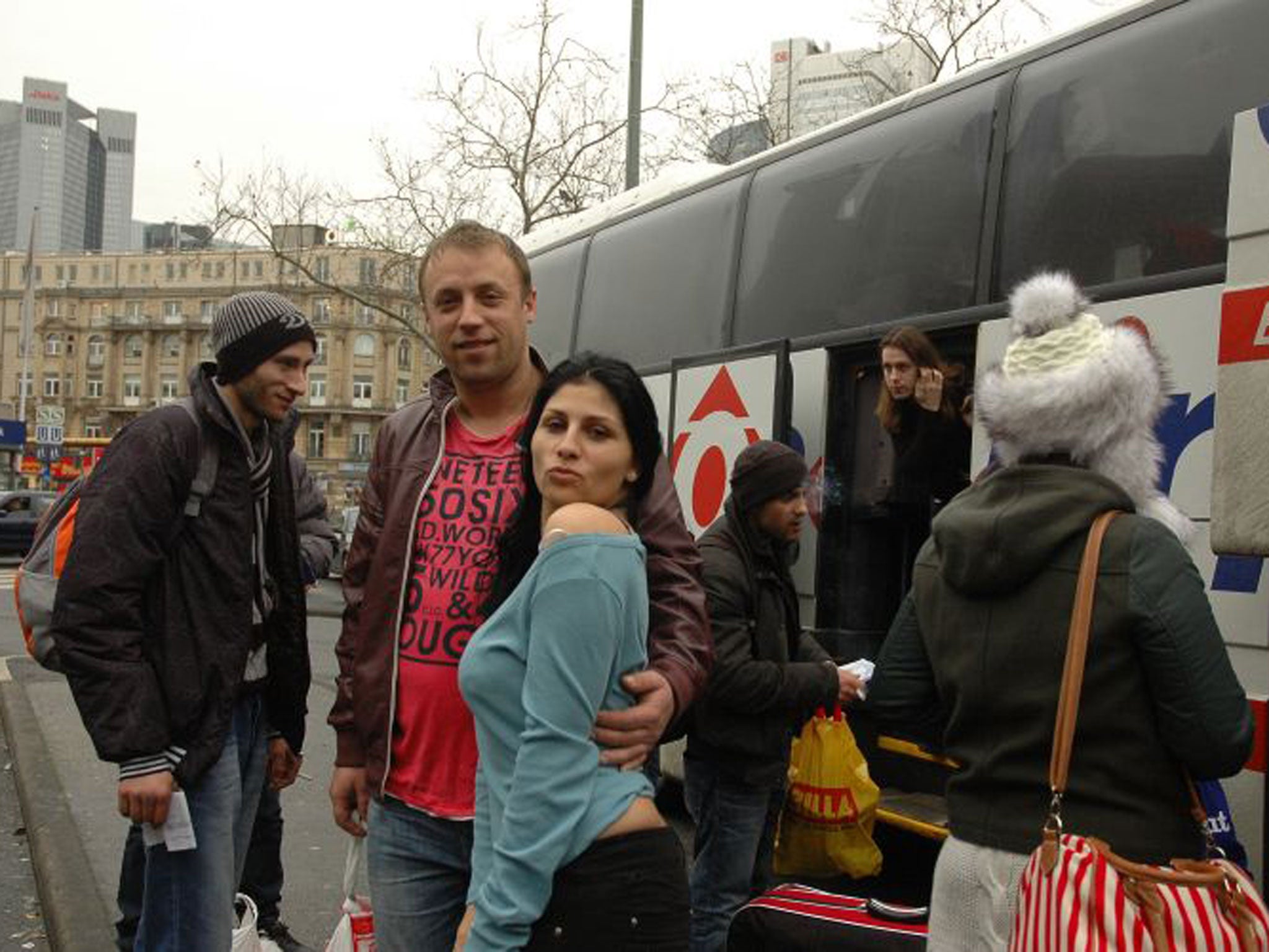 Vali Draghici, centre in the red t-shirt, 40, from Buzău, who was getting off at Frankfurt to work in steel welding and construction. He was one of many builders who befriended Alexandra 'Pamela' Benitez-Pozo, 32, who was going to Cologne where she works