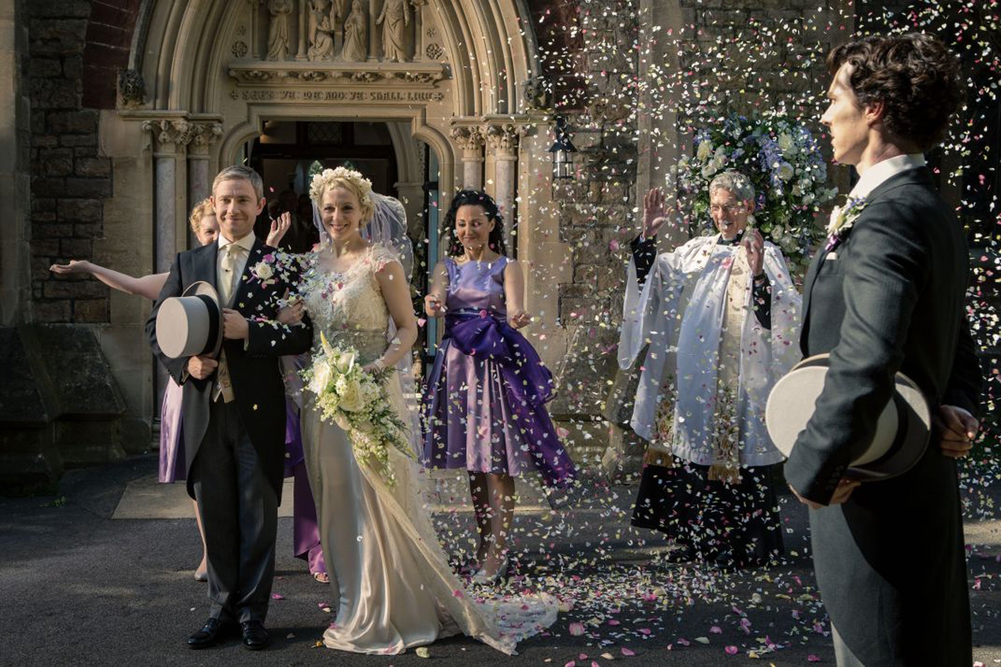 Dr John Watson (Martin Freeman) marries Mary Morstan (Abbington) as Sherlock Holmes (Benedict Cumberbatch) watches on