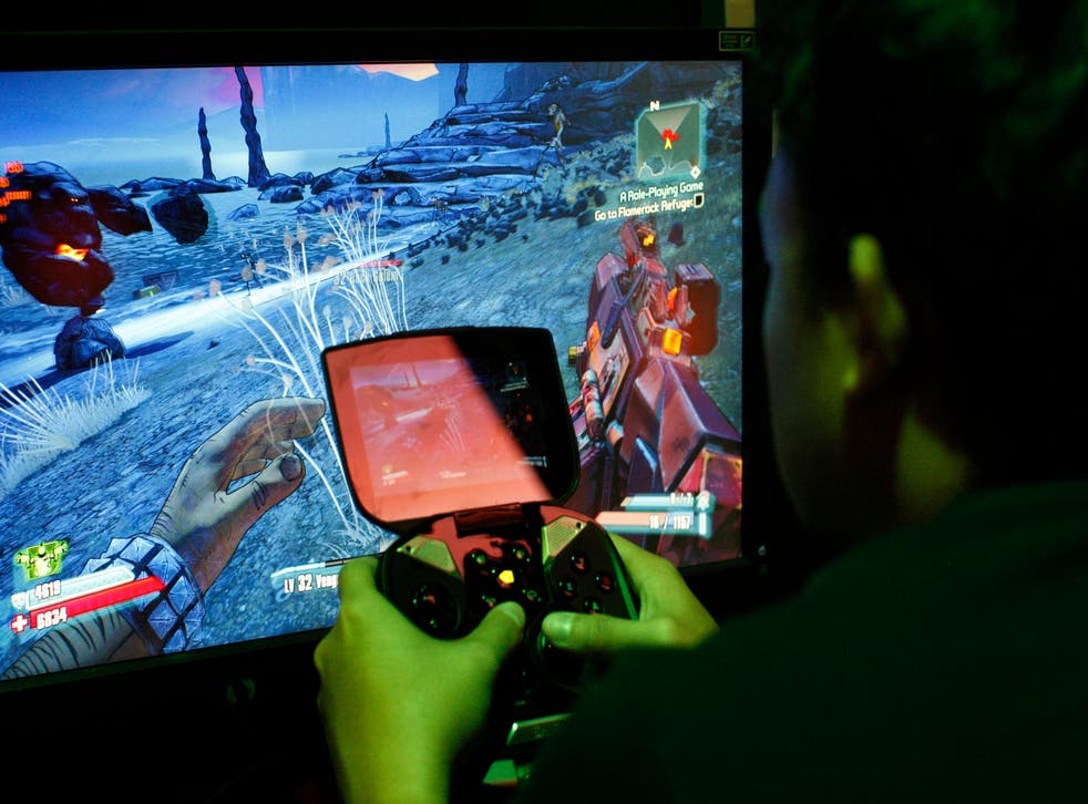 A man tries a game at the Nvidia Shield PC Game Streaming exhibit at E3 in 2013. The Shield was Nvidia's first move into mobile gaming.