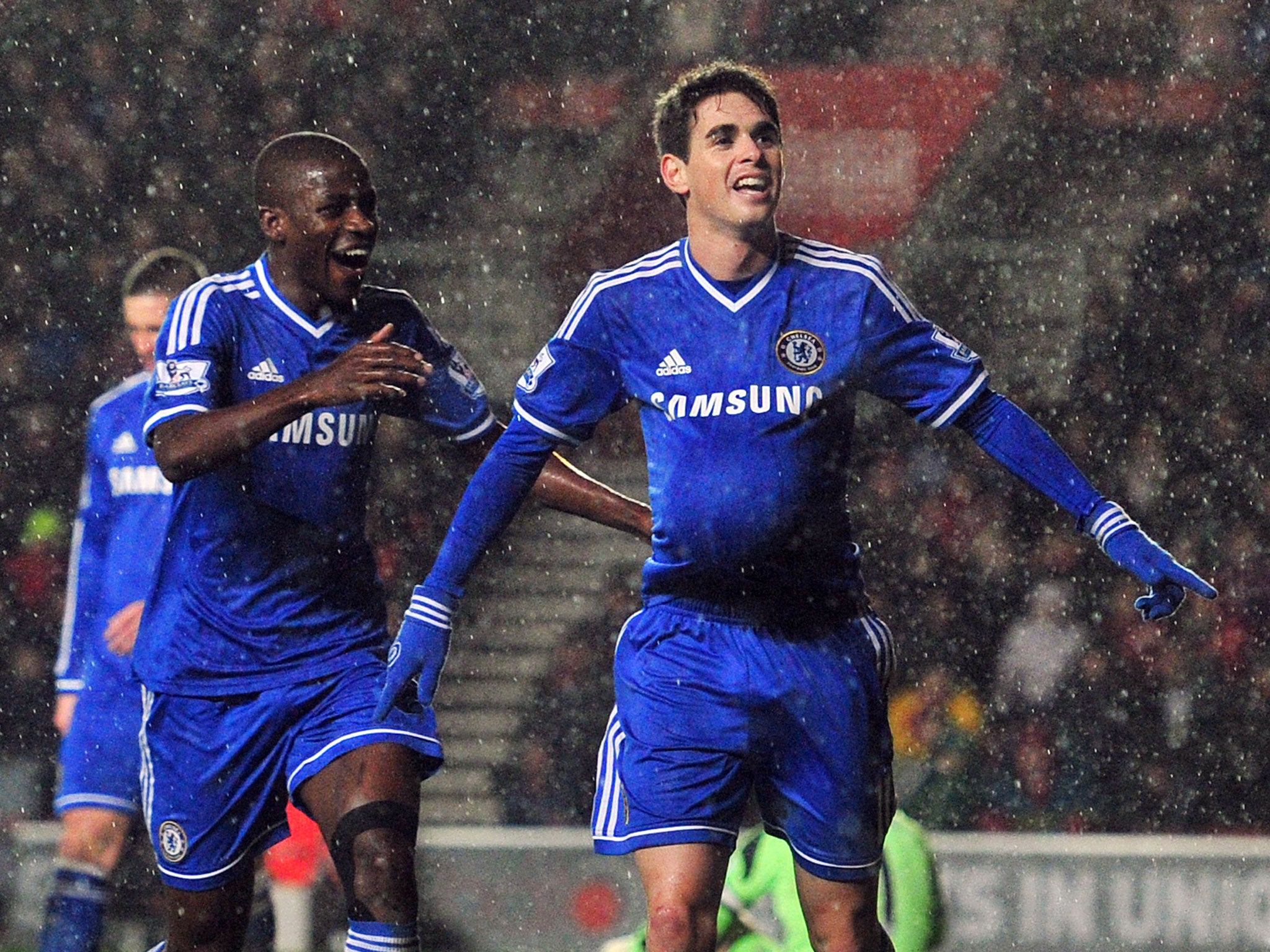 Ramires and Oscar celebrate after the latter scores Chelsea's second goal in the 2-0 win over Derby County